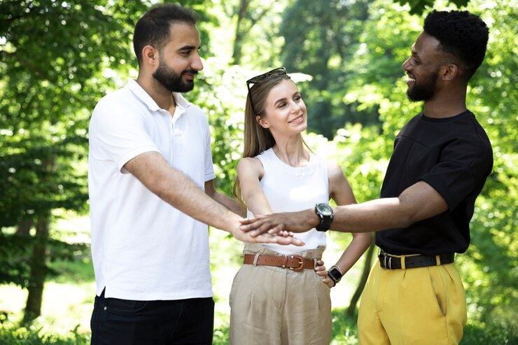 ront view diverse group of friends holding hands